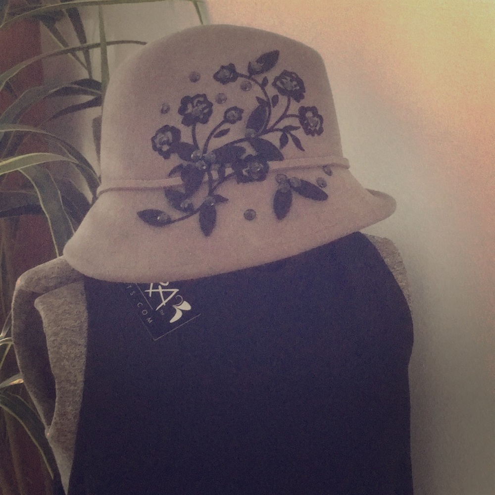 Gray wool hat with black appliqué and beading